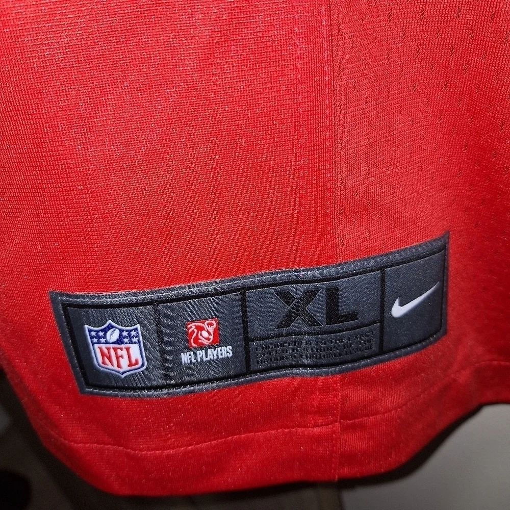 A Nike official NFL #12 Brady jersey in a mens XL and medium. NWOT.
